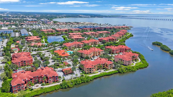 Panoramic view of a coastal residential area with multiple buildings and water bodies.