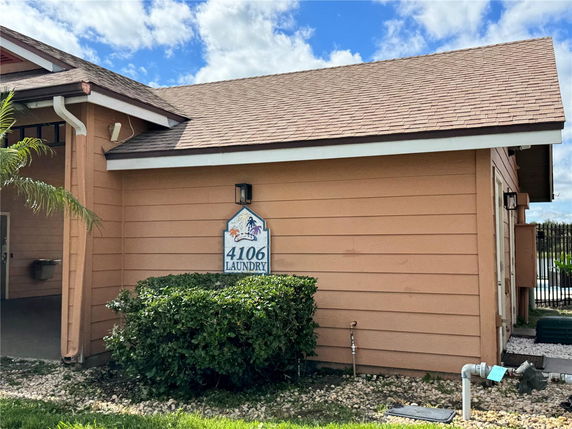 Front view of a building with a sloped roof, marked as a laundry facility.