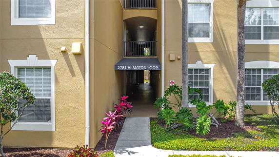 Front view of a building entrance with a labeled awning.