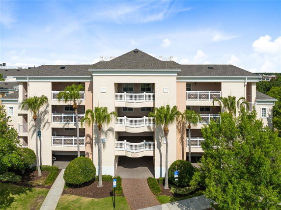 Front view of a multi-story residential building with balconies.