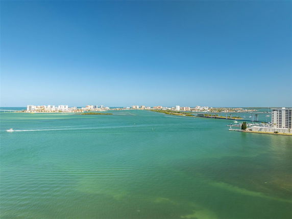 Panoramic view of a coastal area with buildings and waterway.