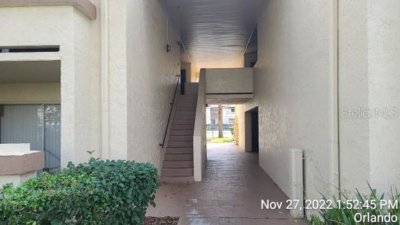 Entrance area with stairway in an outdoor residential building.