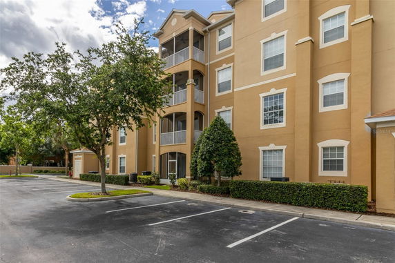 Front view of a multi-story residential building with balconies.