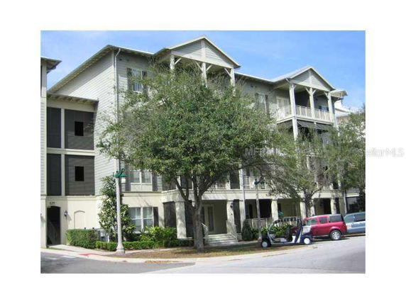 Front view of a multi-story building with balconies.