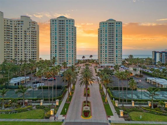 Front view of multi-story residential buildings with ocean backdrop