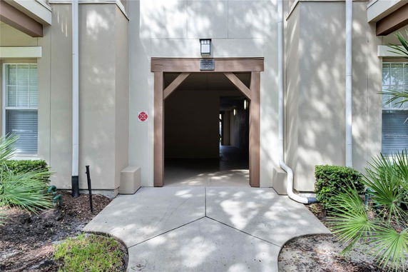 Front view of a building entrance with a covered walkway.