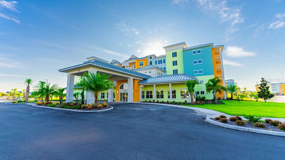 Front view of a multi-story building with colorful exterior.