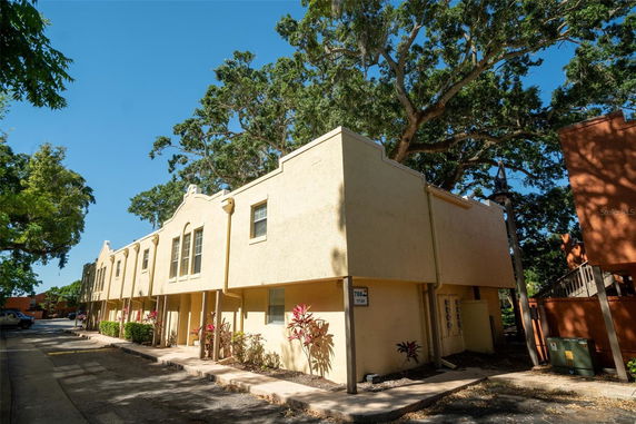 Front view of a two-story apartment building with a beige exterior.