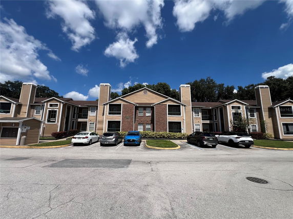 Front view of a two-story apartment building with multiple units.