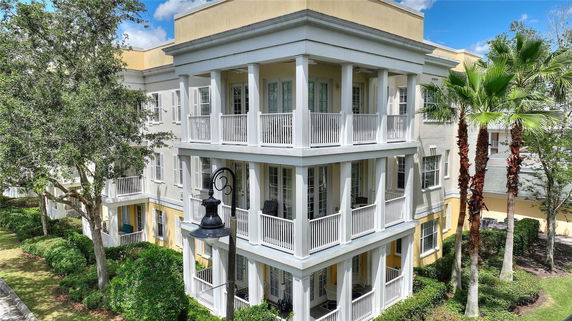 Front view of a multi-story building with balconies.