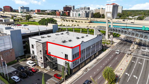 Front view of a multi-story building in an urban area.