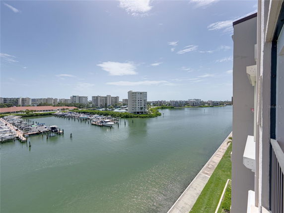 Panoramic view of a waterfront area with buildings and a marina.