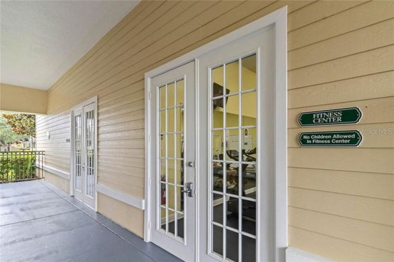 Entrance to a fitness center with glass doors.