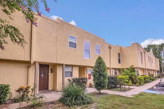 Front view of a two-story townhouse with beige exterior.