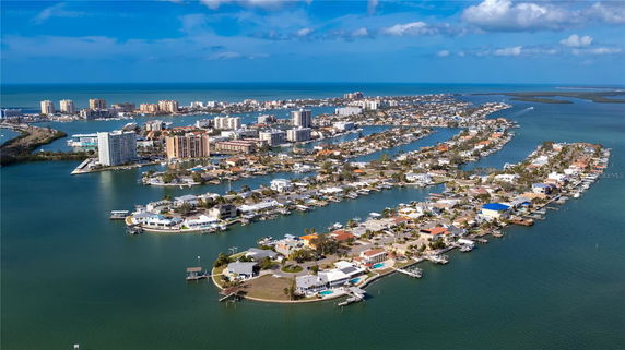 Panoramic view of a coastal city with numerous buildings and waterways.
