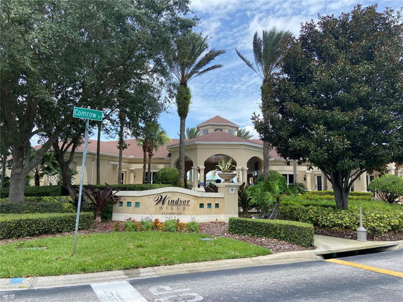Front elevation of a clubhouse building with a sign labeled 'Windsor Hills'.