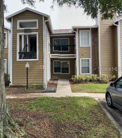 Front view of a two-story apartment building with a central entrance.