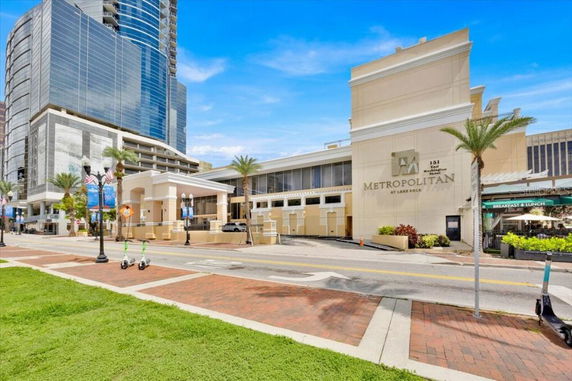 Front view of a large commercial building named Metropolitan at Lake Eola.