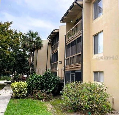 Front view of a multi-story residential building with balconies.