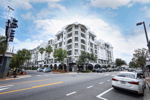 Front view of a multi-story residential building with balconies.