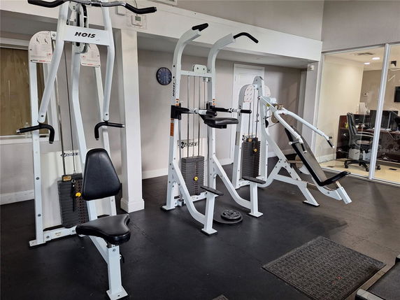 Indoor gym area with exercise machines and equipment