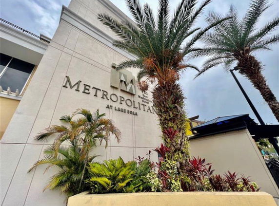 Front view of a building with the name 'Metropolitan at Lake Eola' on the facade.