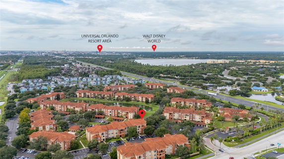Panoramic view of buildings and surrounding landscape including amusement park areas.