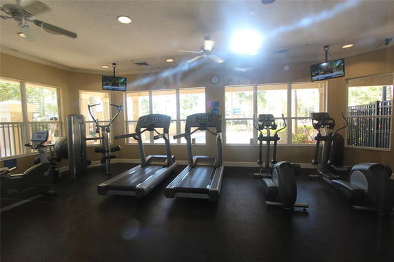 Indoor gym area with treadmills and exercise equipment.