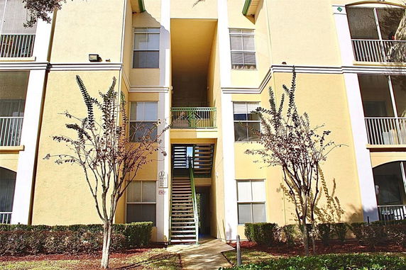 Front view of a multi-story residential building with balconies.