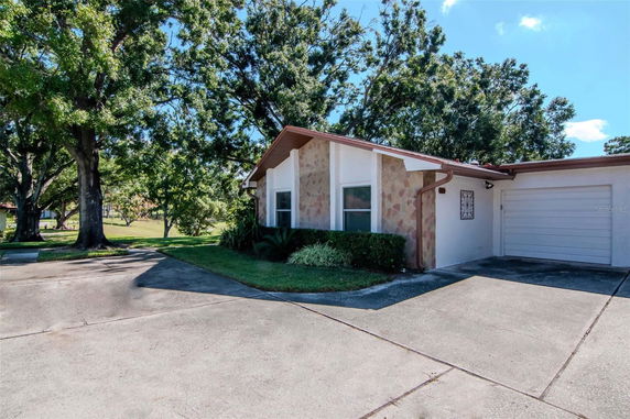 Front view of a single-story house with a garage.