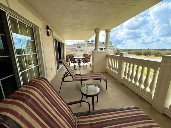 Balcony view with patio furniture and scenic view of the surroundings.