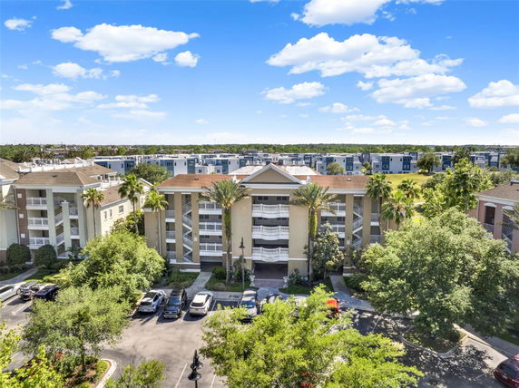 Front view of a multi-story residential building with balconies.