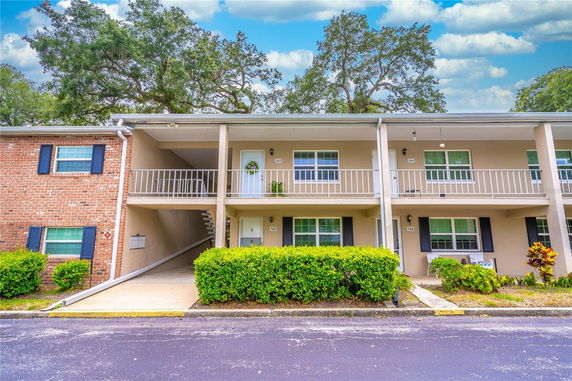 Front view of a two-story residential building with balconies.