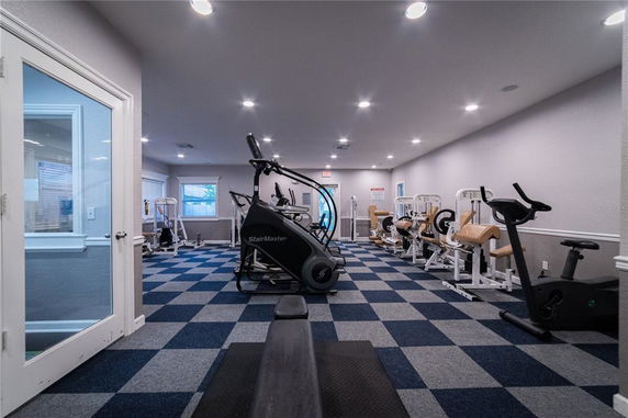 Interior view of a gym area with exercise equipment.