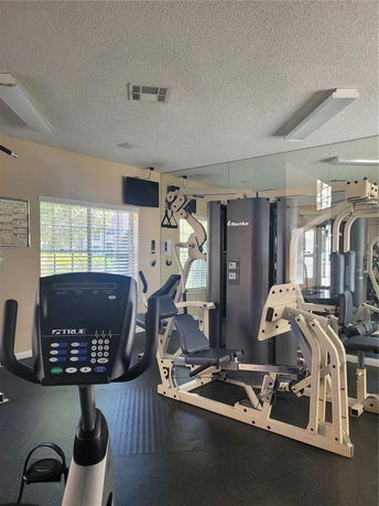 Indoor gym area with exercise equipment.