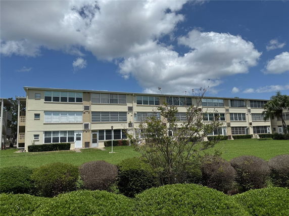 Front view of a three-story apartment building.