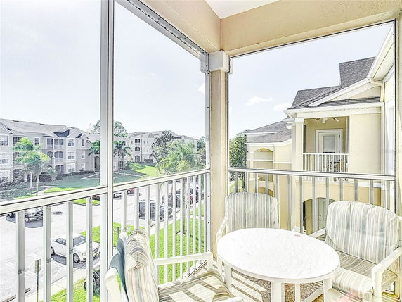 View from a balcony overlooking multiple apartment buildings.