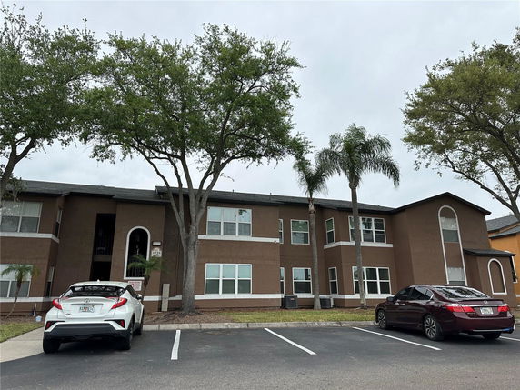 Front view of a two-story building with multiple windows.