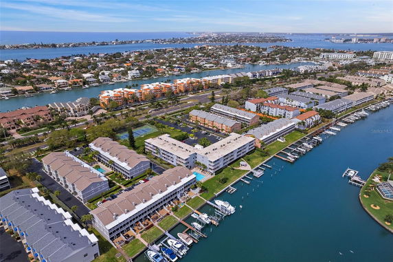 Aerial view of a coastal community with residential buildings and waterways.