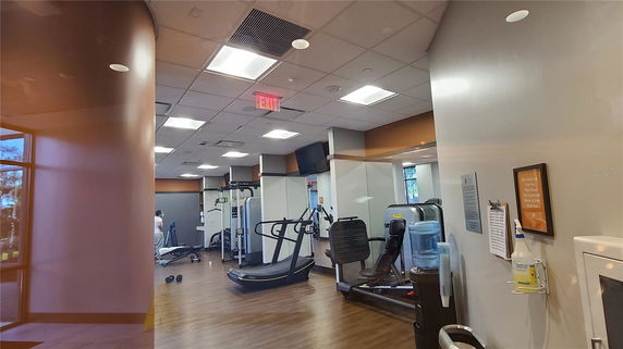 Indoor gym area with exercise equipment.