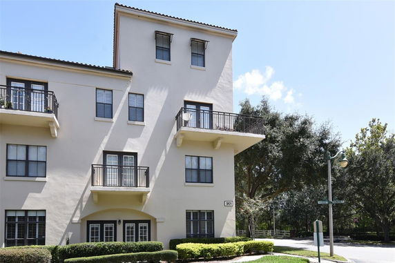 Front view of a multi-story building with balconies.
