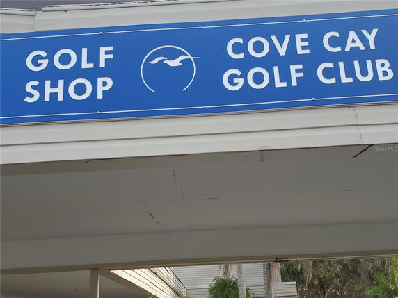 Front view of a building with a golf shop sign.