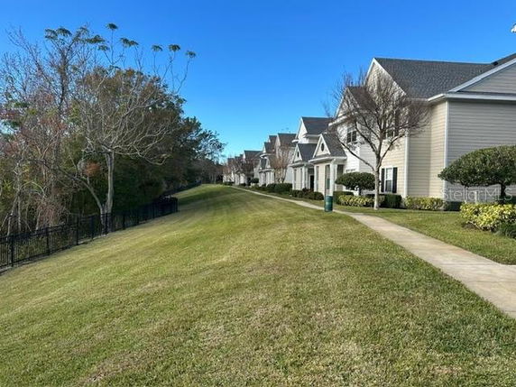 Row of houses with similar architectural style and sloped roofs.