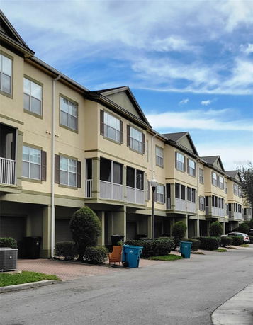 Front view of multi-story residential buildings with garages.