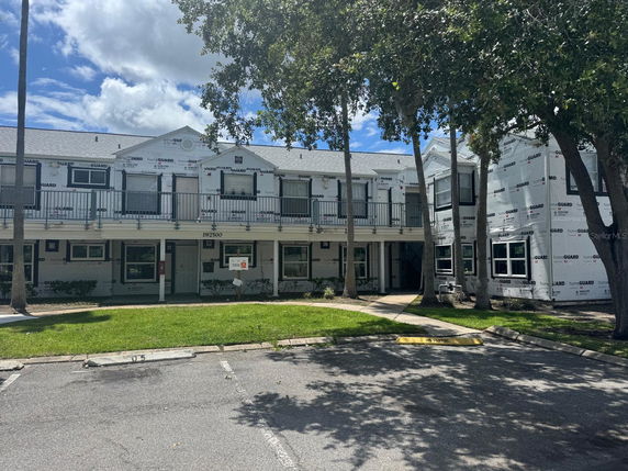 Front view of a two-story building undergoing construction or renovation.
