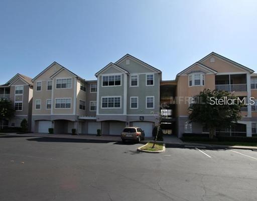 Front view of a multi-story residential building with multiple units.