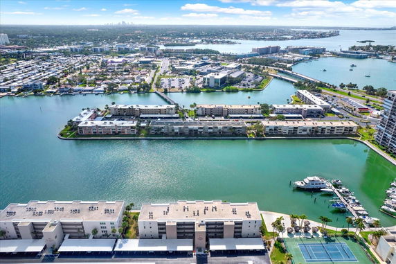 Aerial panoramic view of residential buildings and waterways.