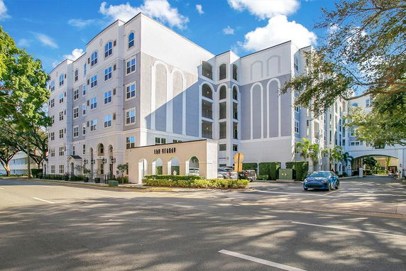Front view of a multi-story residential building with a modern facade.