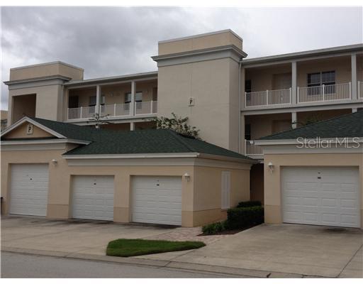 Front view of a multi-story building with attached garages.