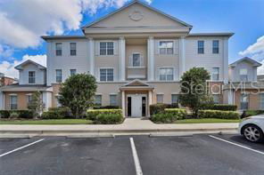 Front view of a multi-story residential building with a symmetrical facade.